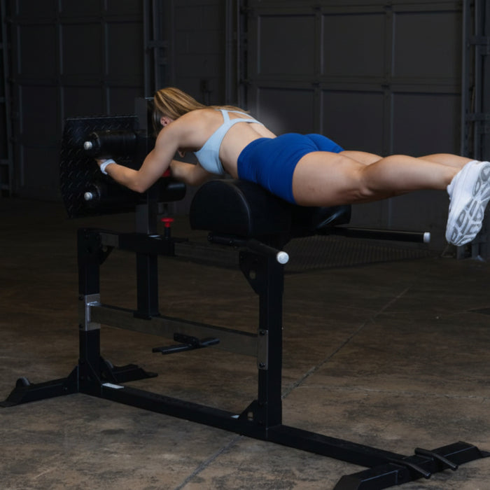 Body-Solid Glute and Ham Machine, Black Finish SGH500B Female User