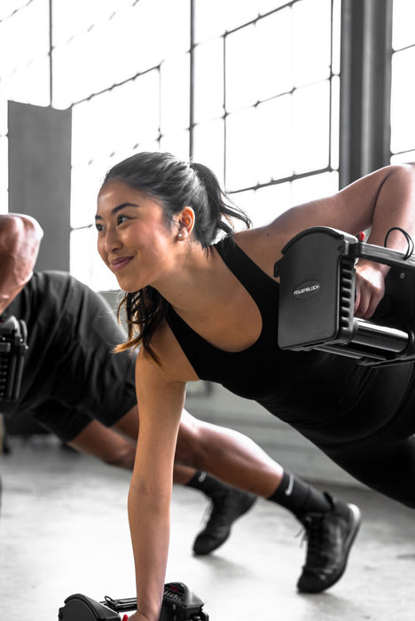 Powerblock pro 50 Adjustable dumbbells Being Used By Femail