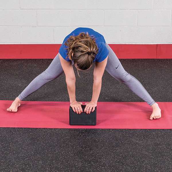 yoga block wide legged forward bend